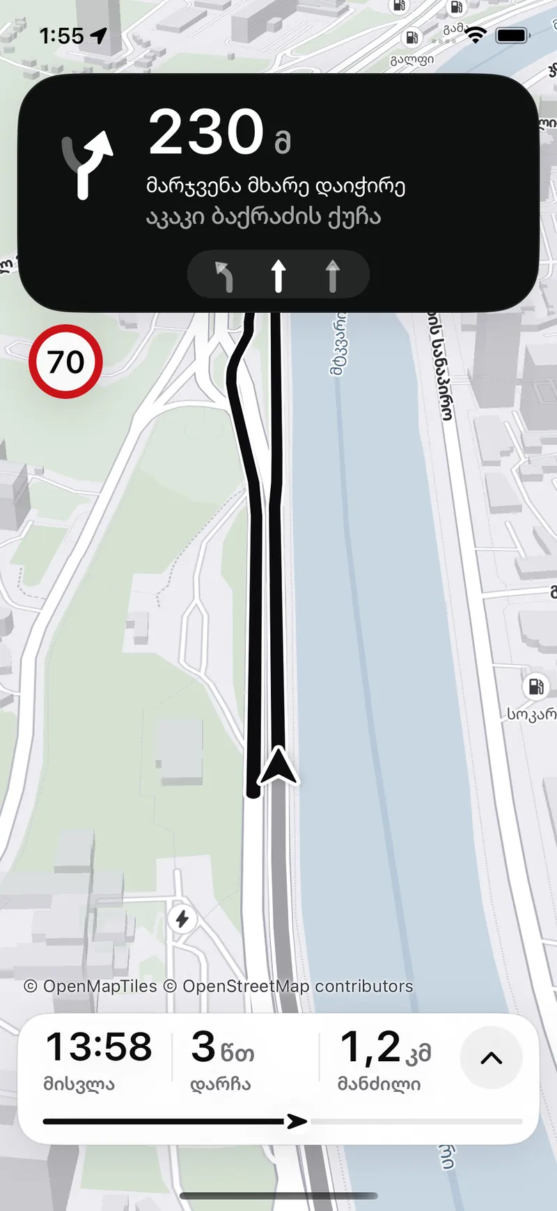 The navigator names the lane: in 230 metres keep right, Akaki Bakradze Street